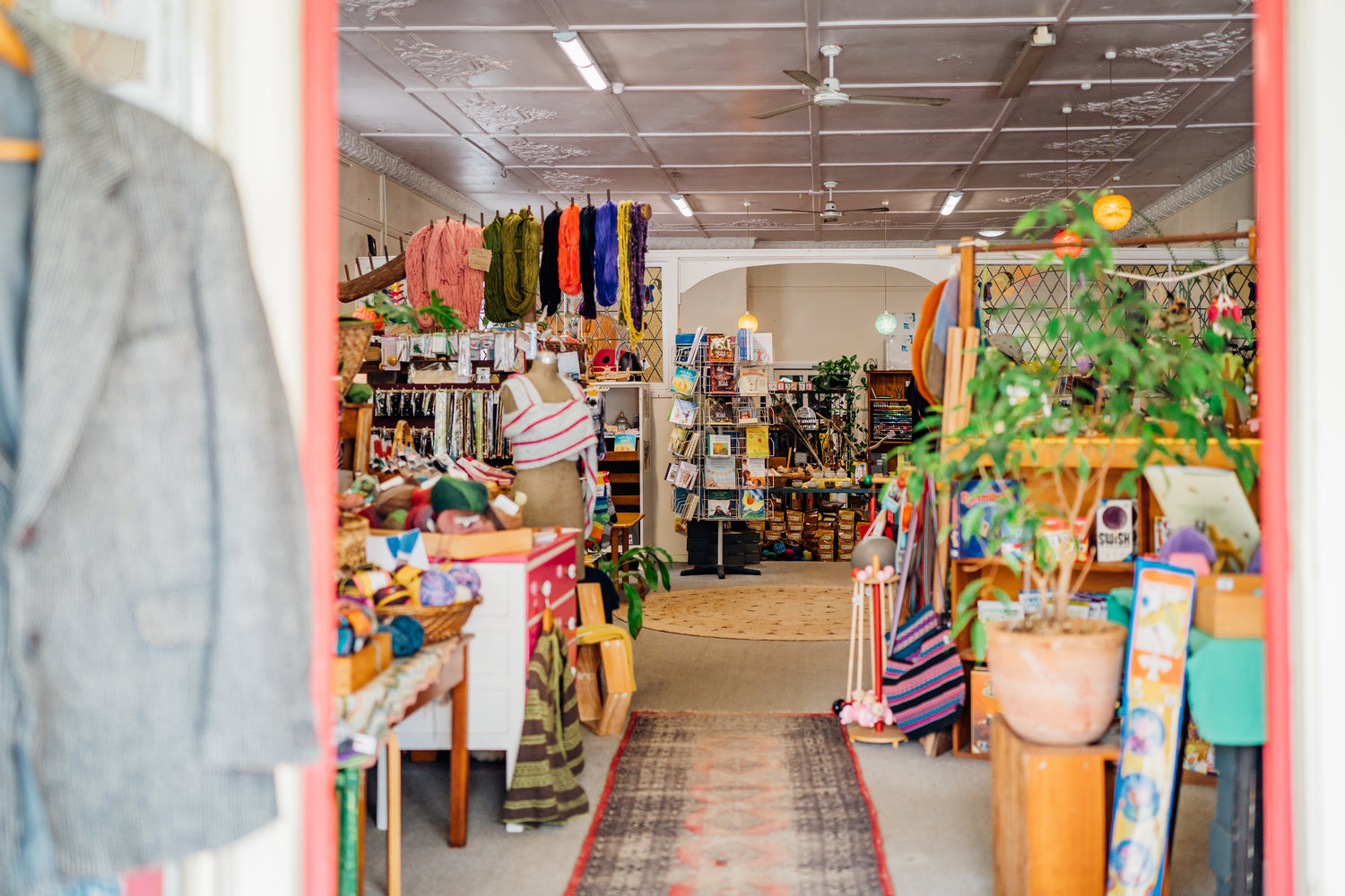 Walking through the door of the weave shop colourful yarns to the left and children's toys and craft to the right